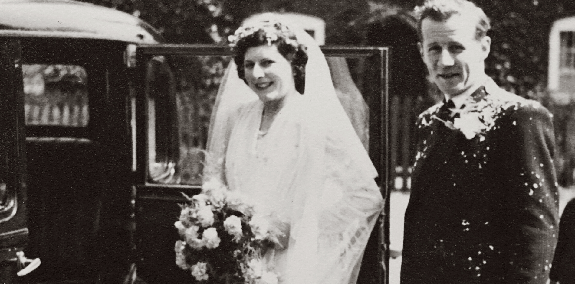 black and white image of mother with 3 children